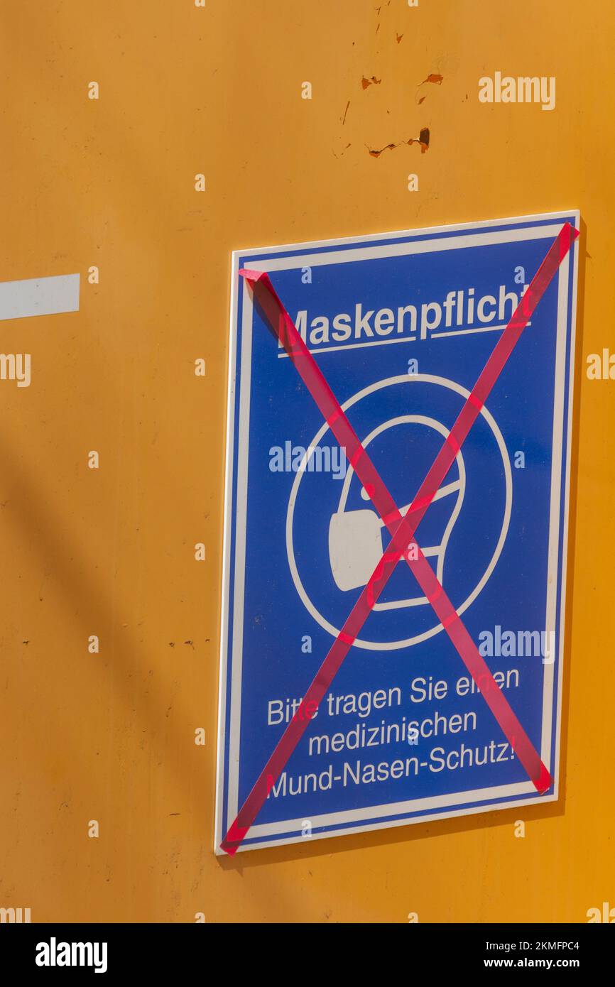 Saarbrücken: sign for covid 19 mask duty crosses out, end of  mask wearing obligation in , Saarland, Germany Stock Photo