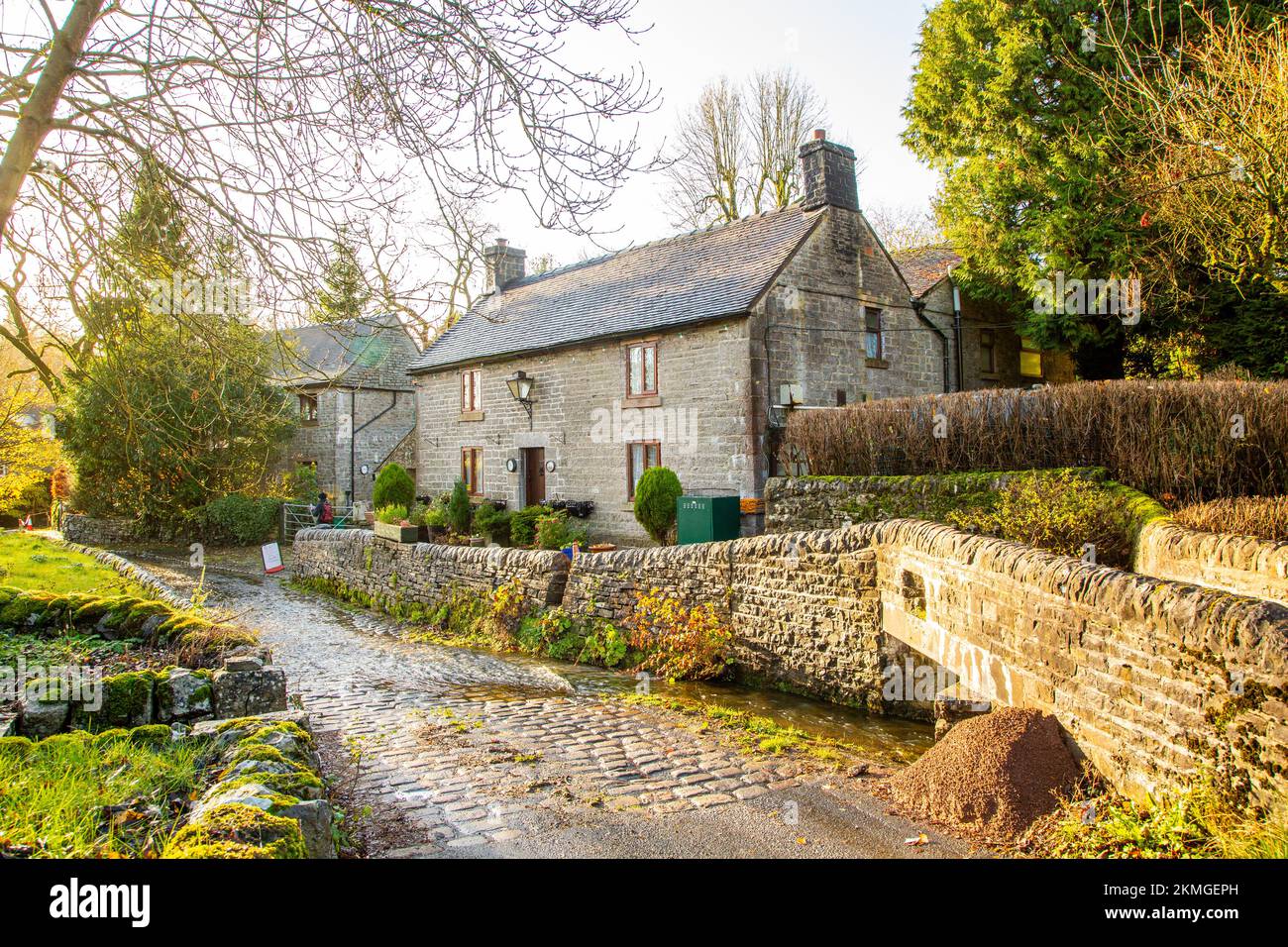 Hoo Brook flowing through the ford over the cobbled main street in the