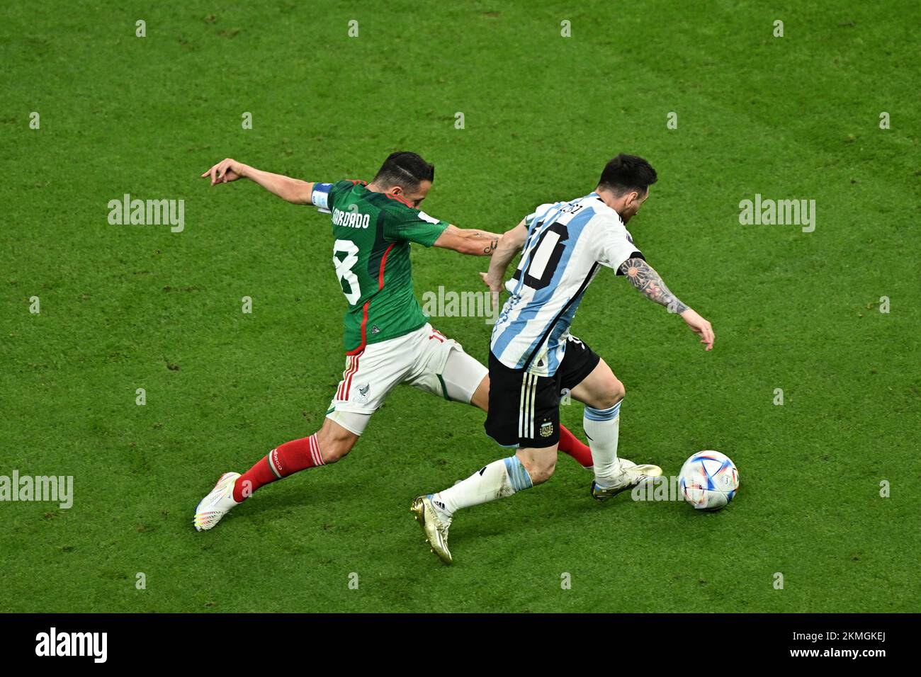 Lusail, Qatar. 26th Nov, 2022. Andres Guardado (L) of Mexico vies with Lionel Messi of Argentina during the Group C match between Argentina and Mexico at the 2022 FIFA World Cup at Lusail Stadium in Lusail, Qatar, Nov. 26, 2022. Credit: Xin Yuewei/Xinhua/Alamy Live News Stock Photo