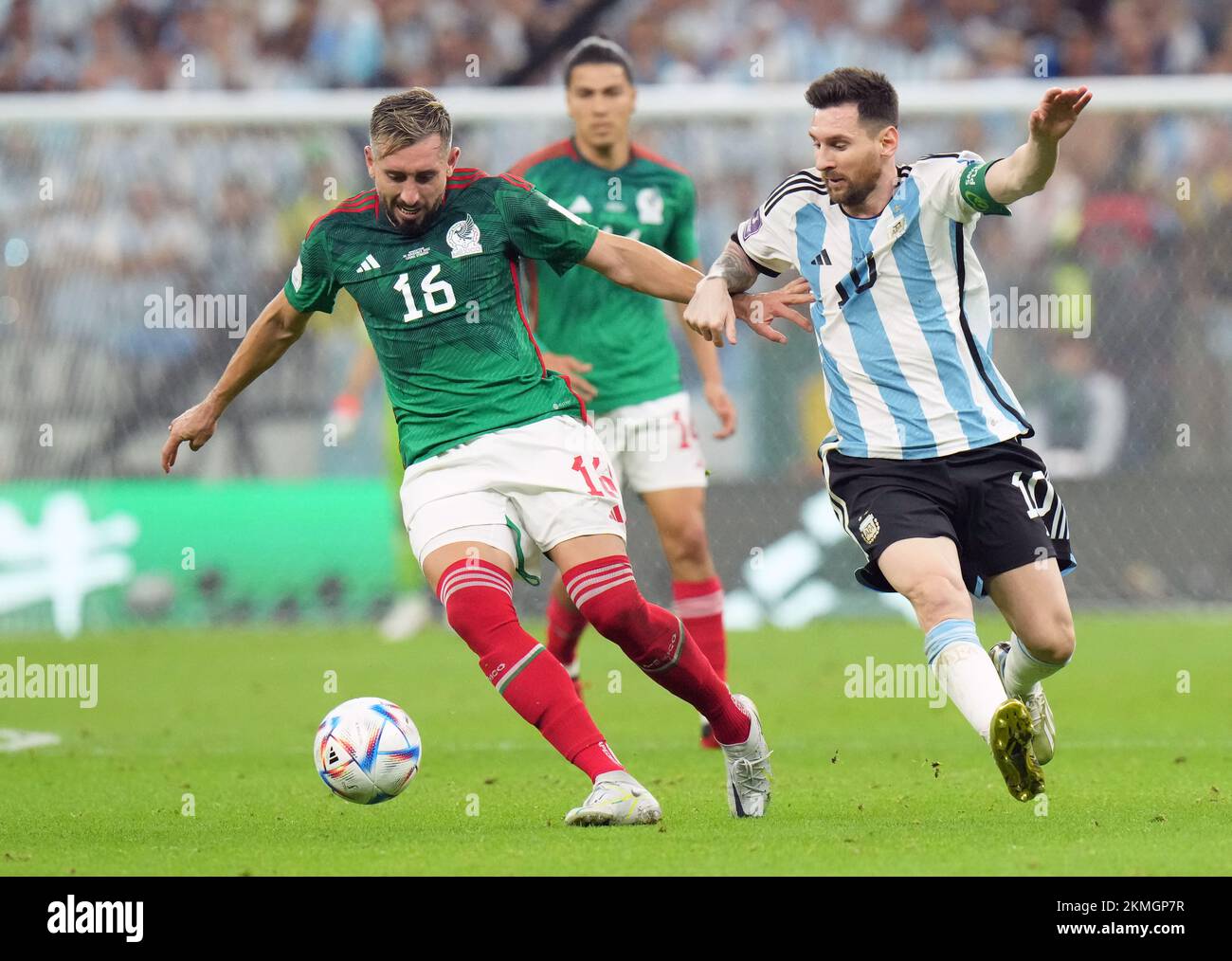 Mexico's Hector Herrera (left) and Argentina's Lionel Messi battle for the ball during the FIFA World Cup Group C match at the Lusail Stadium in Lusail, Qatar. Picture date: Saturday November 26, 2022. Stock Photo