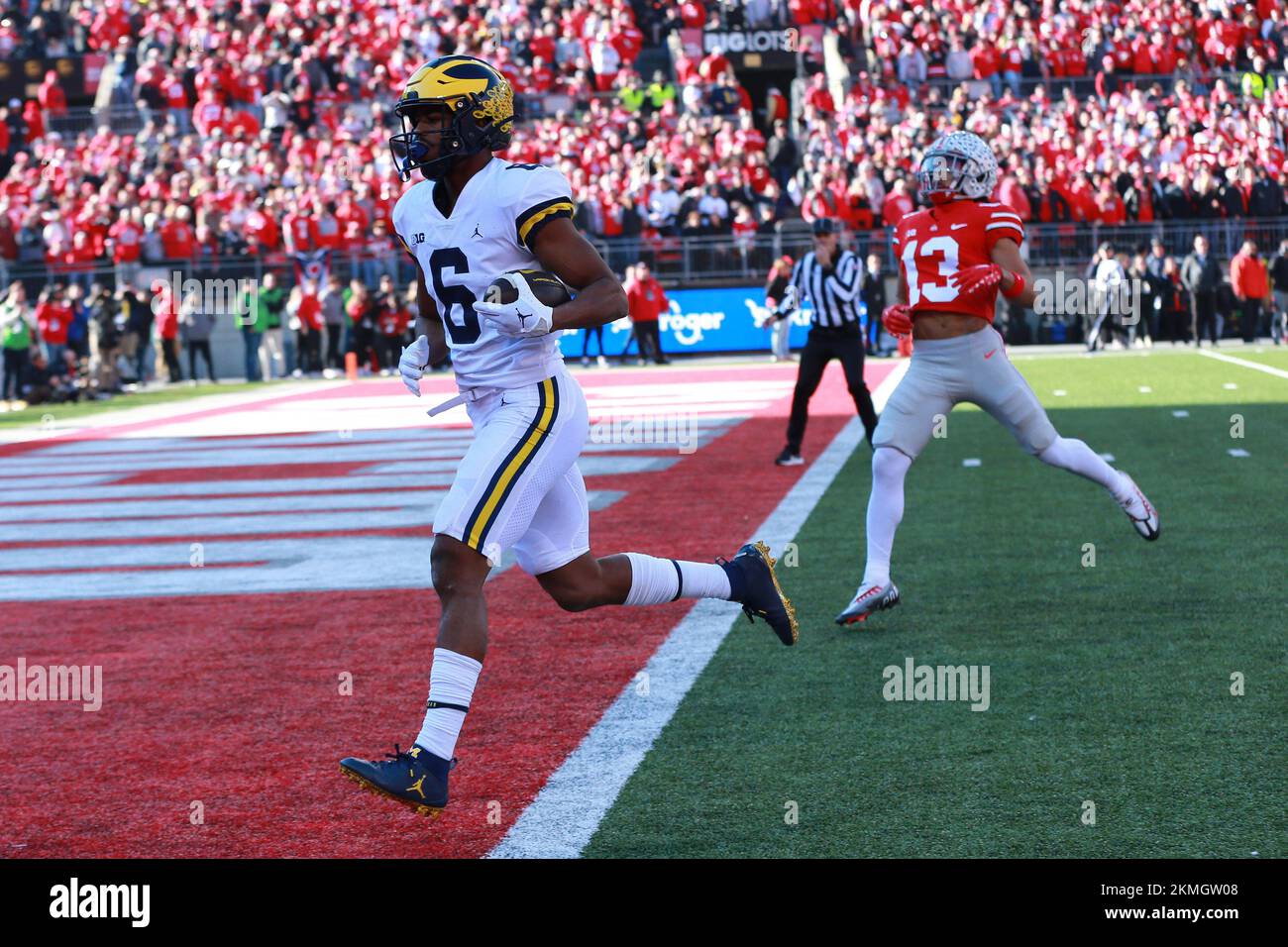 Columbus, United States. 26th Nov, 2022. Michigan Wolverines Cornelius Johnson (6) glides into the endzone past Ohio State Buckeyes Cameron Martinez (13) for a touchdown during the first half in Columbus, Ohio on Saturday, November 26, 2022. Photo by Aaron Josefczyk/UPI Credit: UPI/Alamy Live News Stock Photo