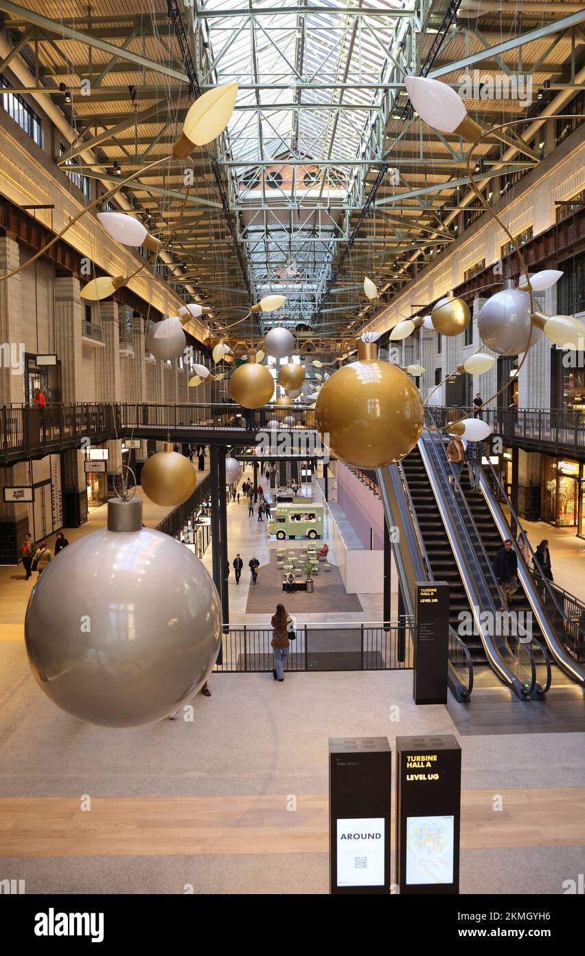 Turbine Hall A in the reopened Battersea Power Station, with stylish Christmas baubles up, in SW London, UK Stock Photo