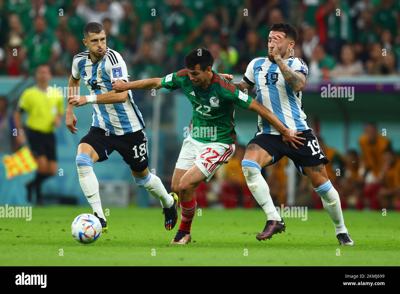 Doha, Qatar. 26th Nov, 2022. Nicolas Otamendi (R) of Argentina in action with Hirving Lozano of Mexico during the 2022 FIFA World Cup Group C match at Lusail Stadium in Doha, Qatar on November 26, 2022. Photo by Chris Brunskill/UPI Credit: UPI/Alamy Live News Stock Photo