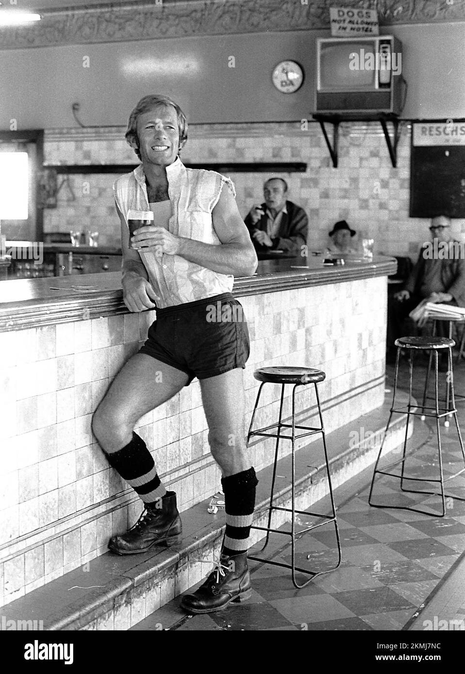 Paul Hogan haveing a drink in a pub in Paddington, Sydney 1972 Stock