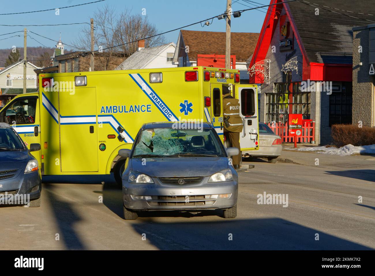 Ambulance at the scene of a car accident with a pedestrian. Quebec