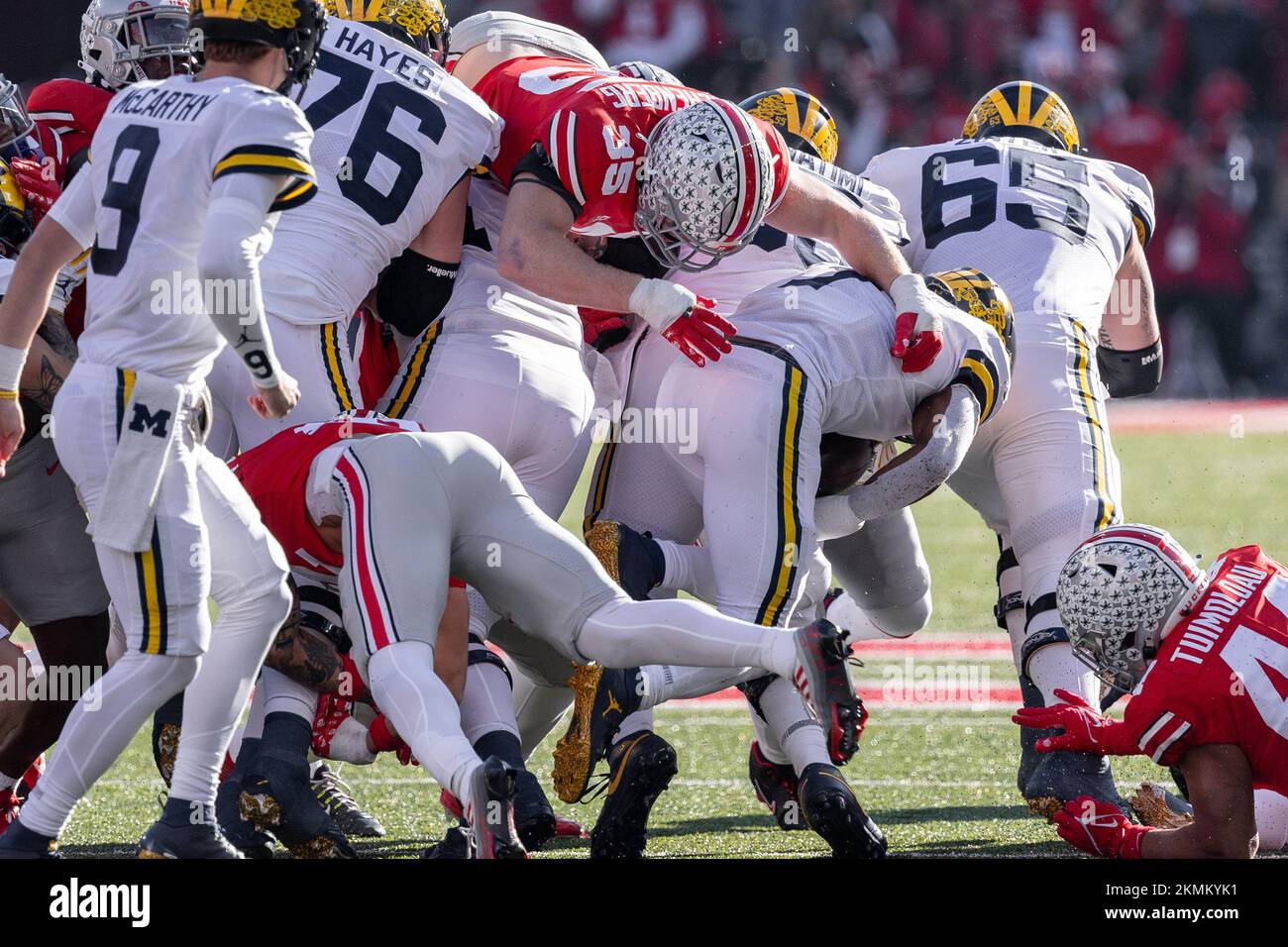 Columbus, Ohio, USA. 26th Nov, 2022. Ohio State Buckeyes linebacker Tommy Eichenberg (35) goes over the pile to tackle Michigan Wolverines running back Donovan Edwards (7) during the game between the Michigan Wolverines and the Ohio State Buckeyes at Ohio Stadium, Columbus, Ohio. (Credit Image: © Scott Stuart/ZUMA Press Wire) Stock Photo