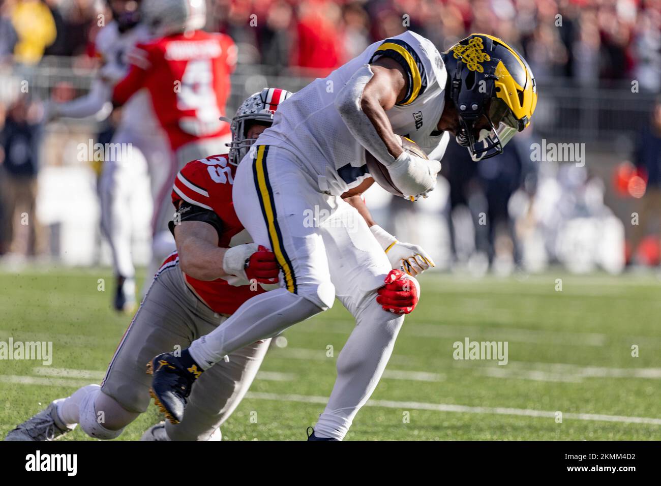 Columbus, Ohio, USA. 26th Nov, 2022. Ohio State Buckeyes linebacker Tommy Eichenberg (35) tackles Michigan Wolverines running back Donovan Edwards (7) after a pass completion during the game between the Michigan Wolverines and the Ohio State Buckeyes at Ohio Stadium, Columbus, Ohio. (Credit Image: © Scott Stuart/ZUMA Press Wire) Stock Photo