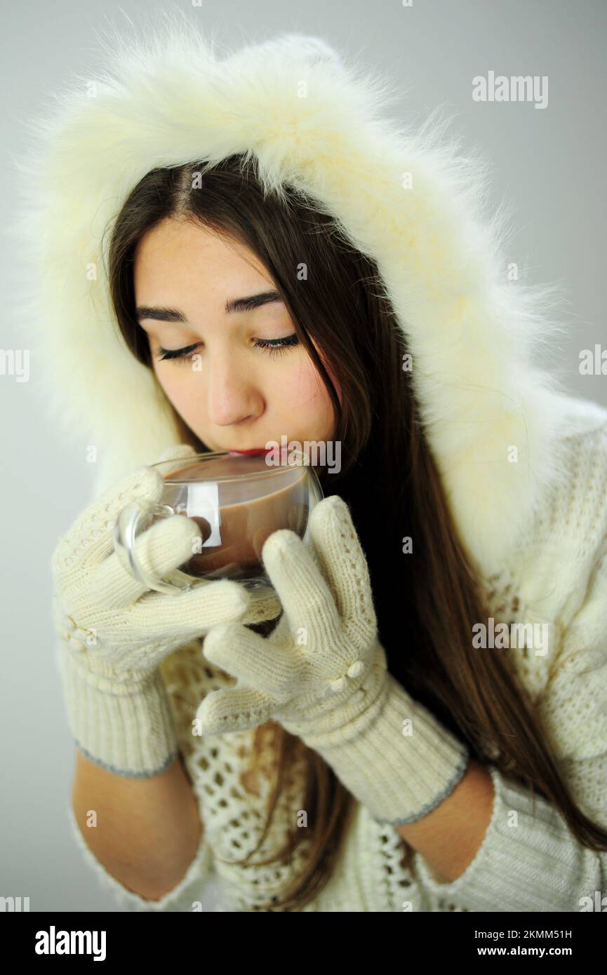 To advertise New Year warming drinks tea and coffee Beautiful young