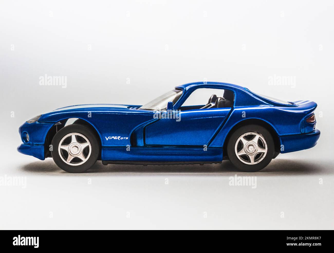 Modern auto design on a Dodge Viper GTS model car captured side on in studio composition. In race blue Stock Photo