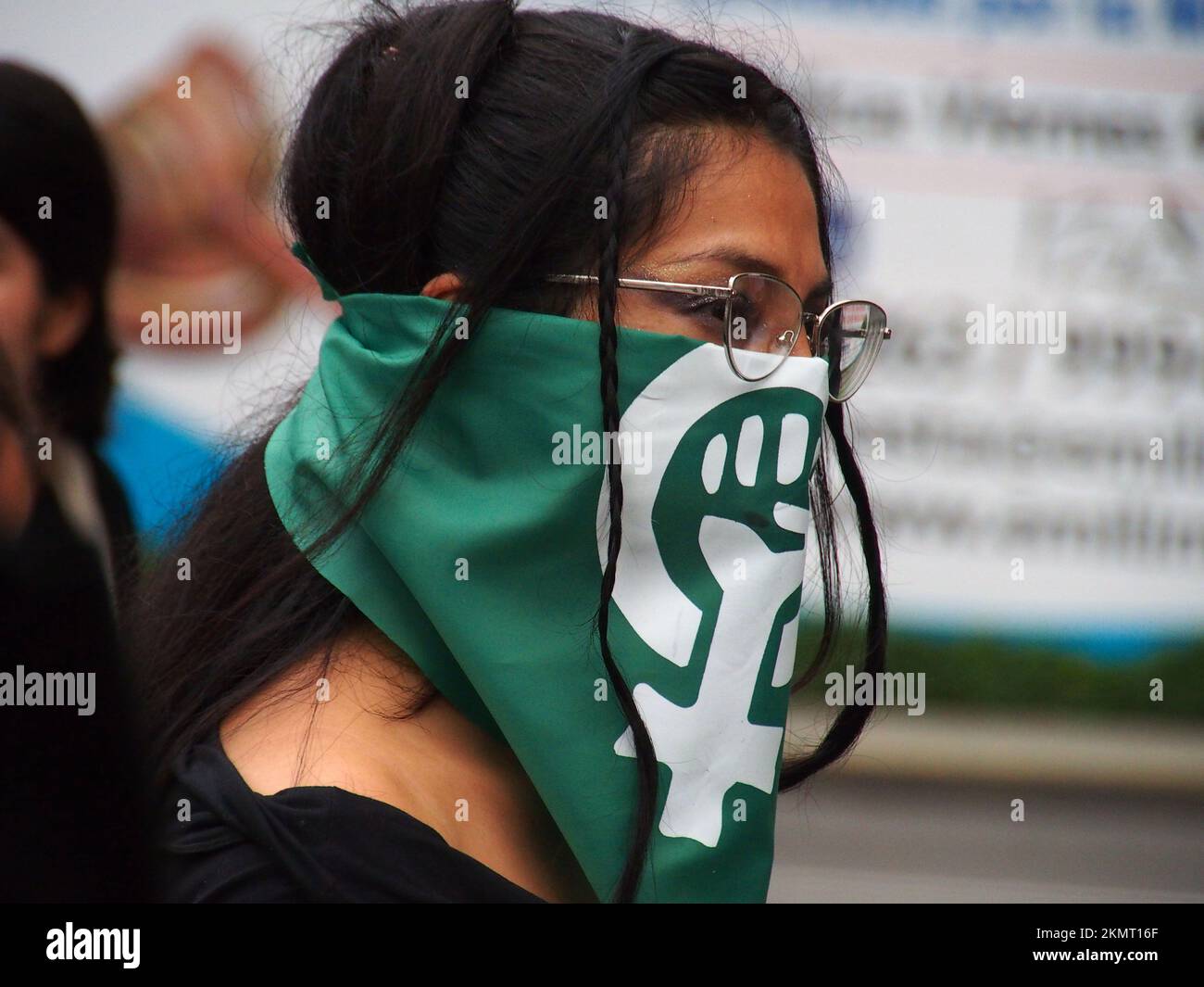Lima, Peru. 25th Nov 2022. Woman wearing a green feminist scarf when thousands of women took to the street of Lima as part of the activities of the International Day for the Elimination of Violence Against Women, an event that is commemorated annually on November 25, the date on which the three Mirabal sisters (Patria, Minerva and María Teresa) were murdered. in the Dominican Republic on 1960. Credit: Fotoholica Press Agency/Alamy Live News Stock Photo