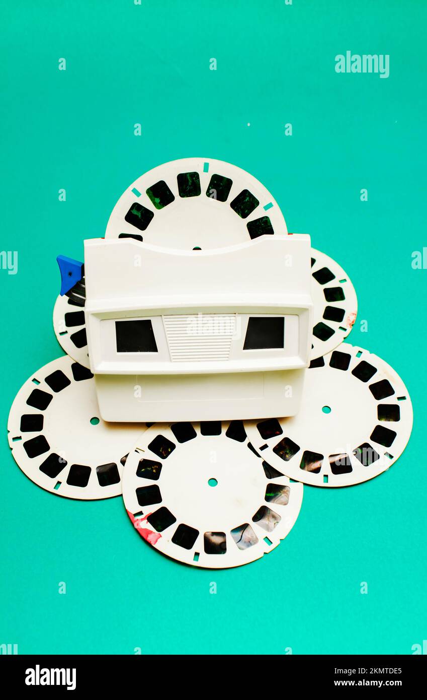 Retro blue object photo on a classic old vintage 3d viewer toy captured  placed on circular film reels. Toys from the 1980s Stock Photo - Alamy
