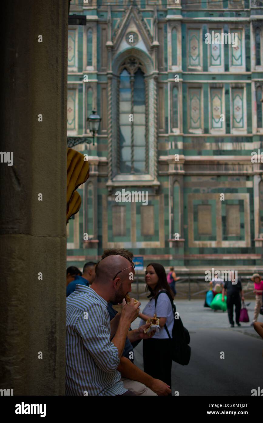 Street food scene in Florence with the Basilica di Santa Croce in the background Stock Photo
