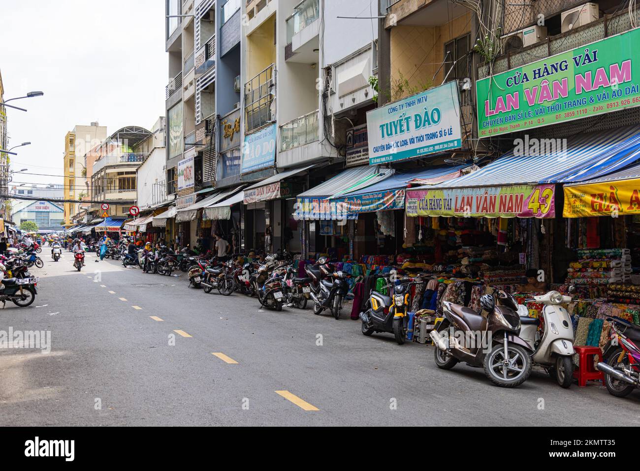 Ho Chi Minh City, Vietnam - November 8, 2022: Fabric stores in an alley