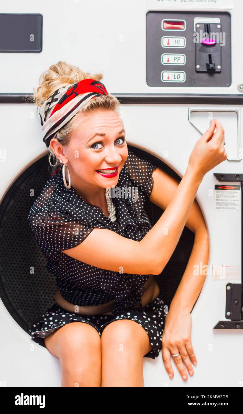 Quick rinse pinup girl washing 1950s clothes in funny style while