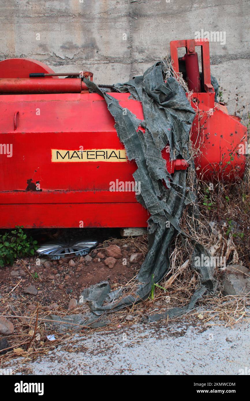 A vertical shot of abandoned red construction tools on a quarry Stock ...