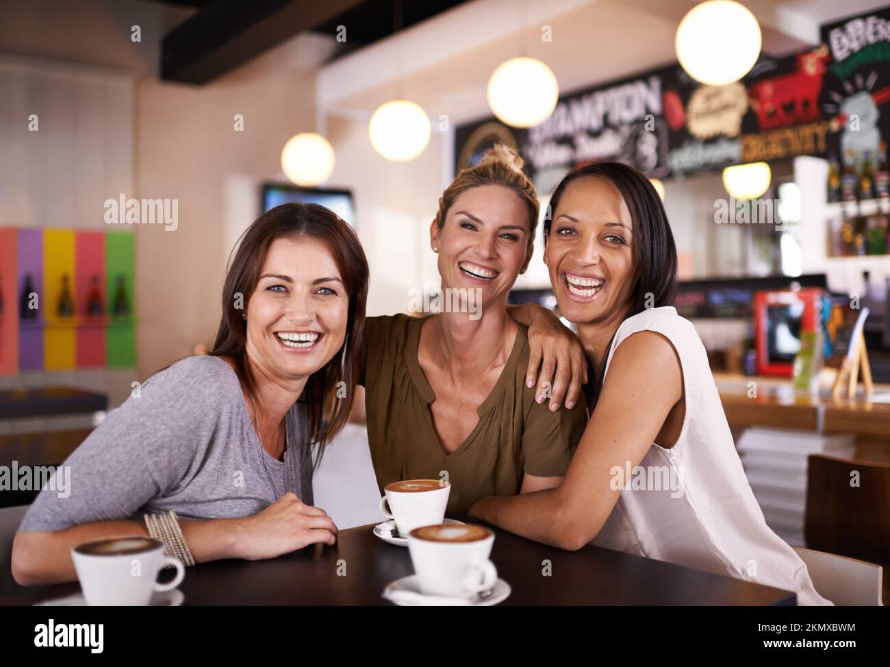 Fun with their besties. Portrait of three friends having fun at a coffee shop together. Stock Photo