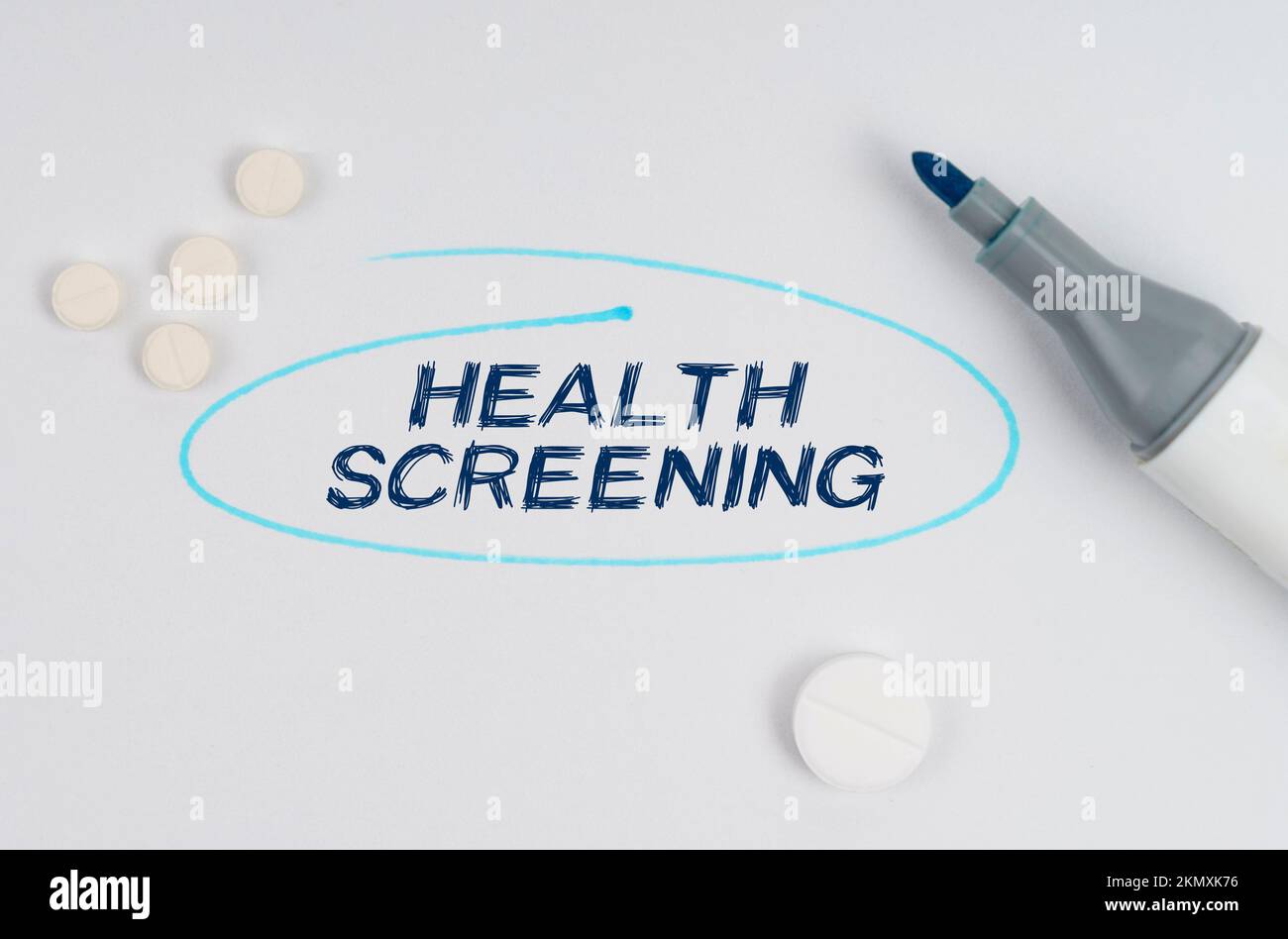 Medicine and healthcare concept. On a white sheet of paper, tablets, a ...