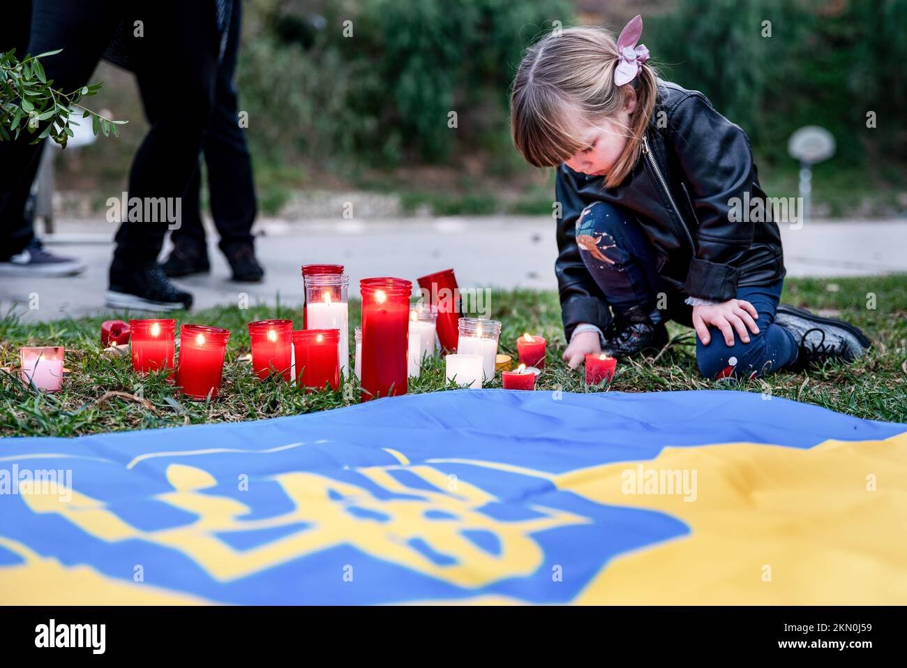Barcelona, Spain. 26th Nov, 2022. A little girl places a candle on the