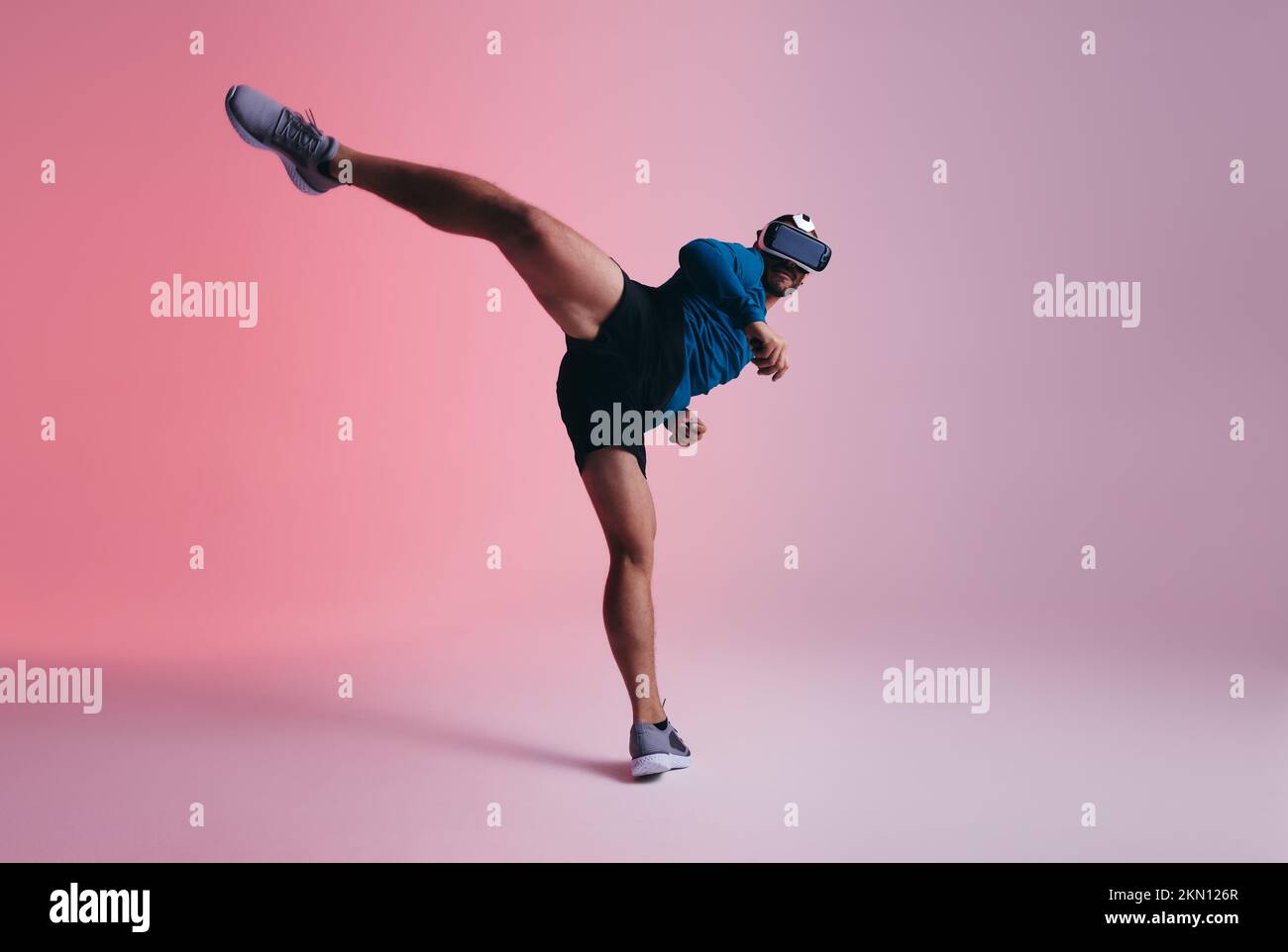 Gamer practicing martial arts in the metaverse. Sporty young man