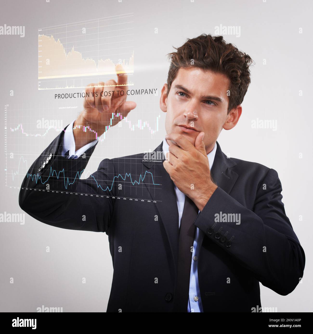 These figures are promising. a thoughtful-looking businessman using a ...