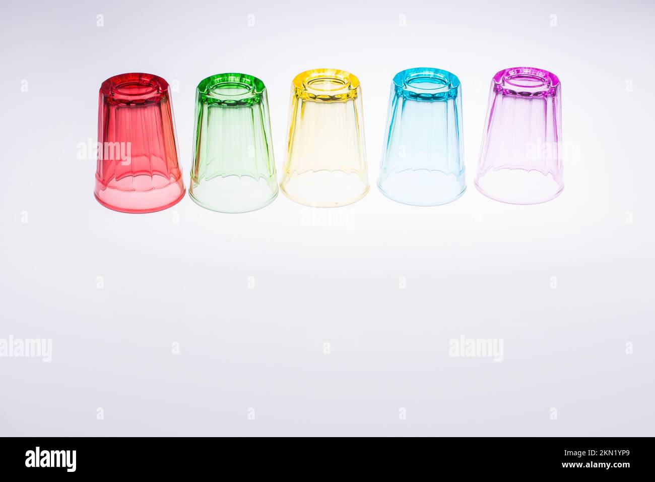 Colorful drinking glasses on white background Stock Photo
