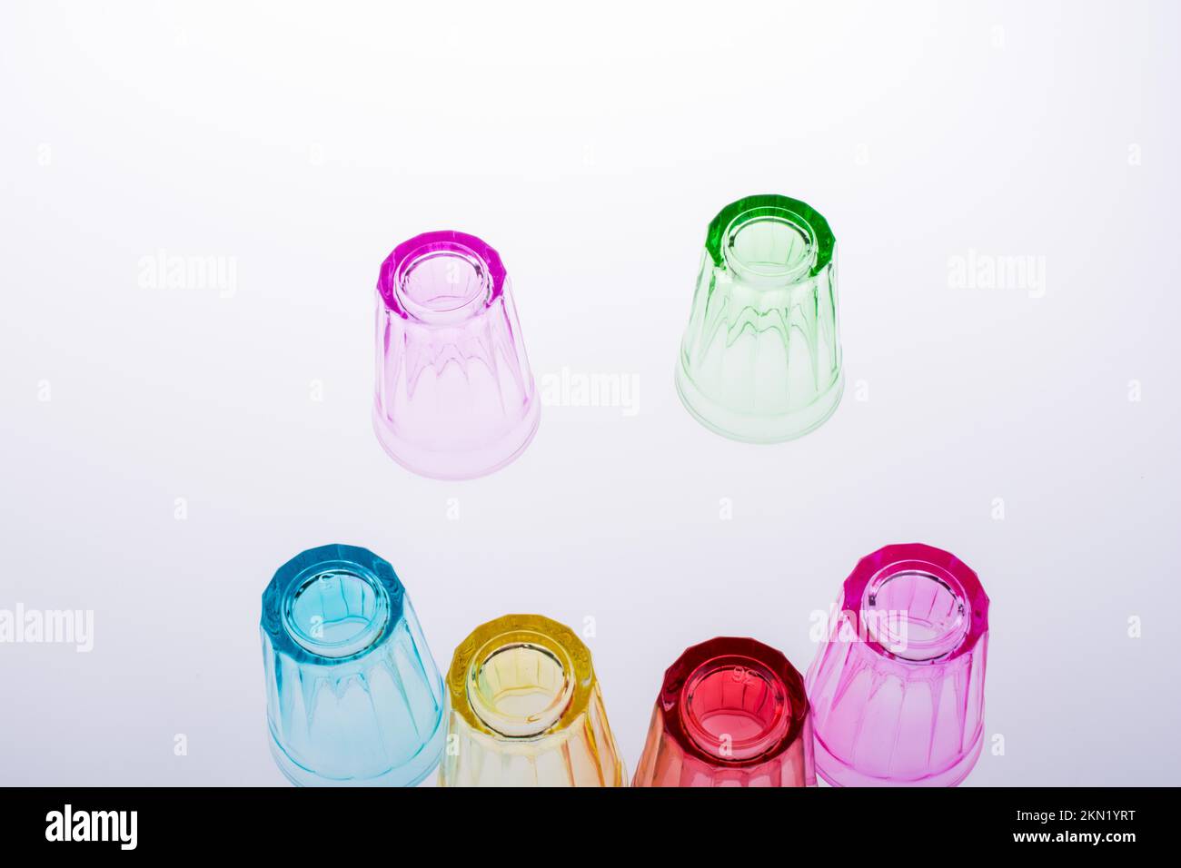 Colorful drinking glasses on white background Stock Photo