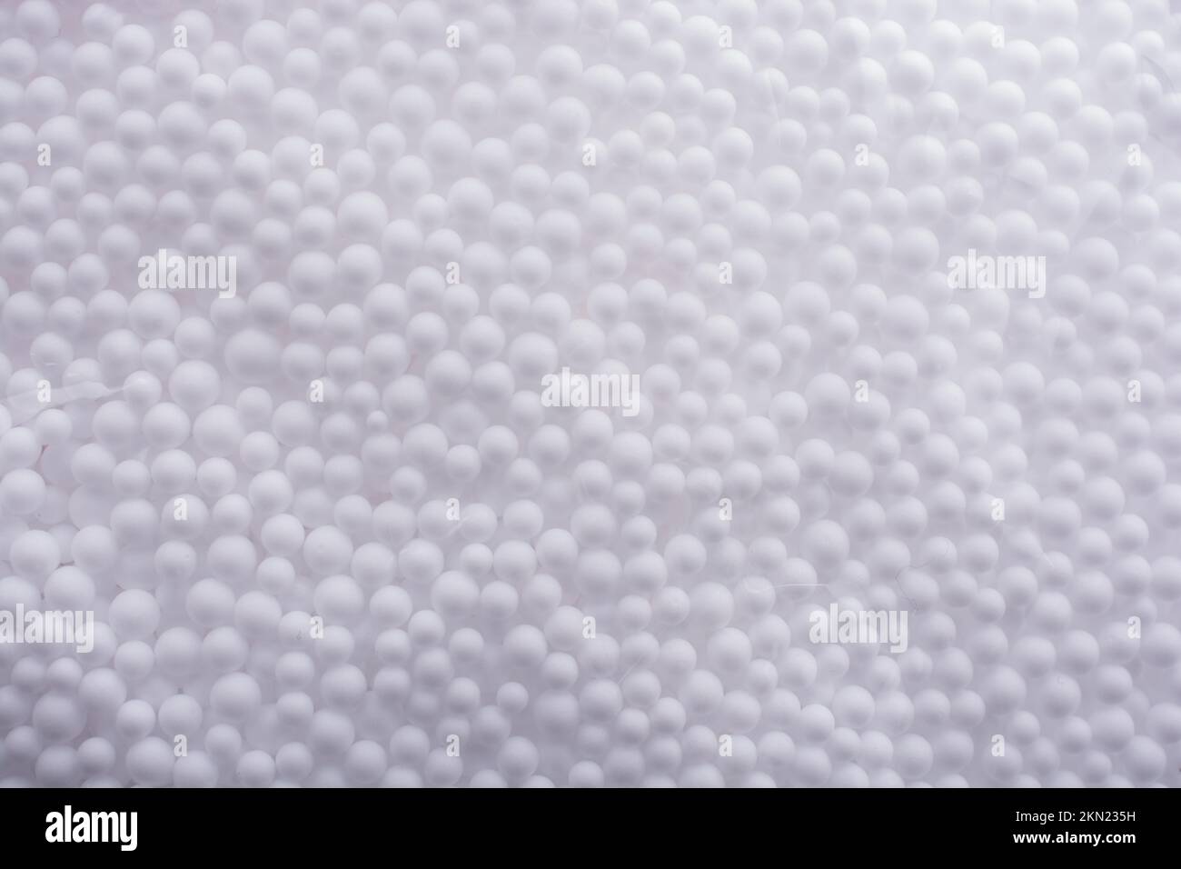 White little polystyrene foam balls as background Stock Photo - Alamy