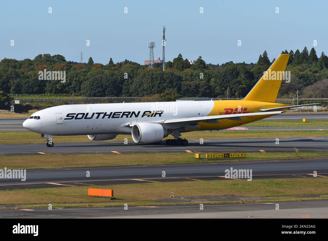 Chiba Prefecture, Japan - October 29, 2021: DHL Boeing B777F (N774SA) freighter. Stock Photo