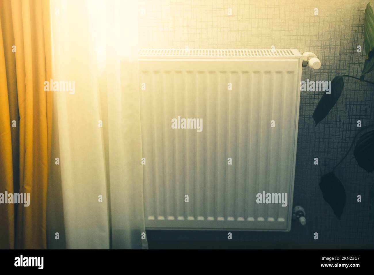 White radiator with temperature control valve central heating in modern ...