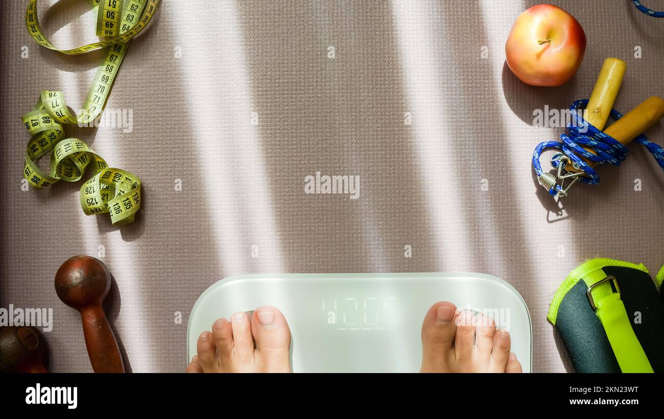 female-on-the-weight-scale-for-check-weight-diet-concept-young-woman