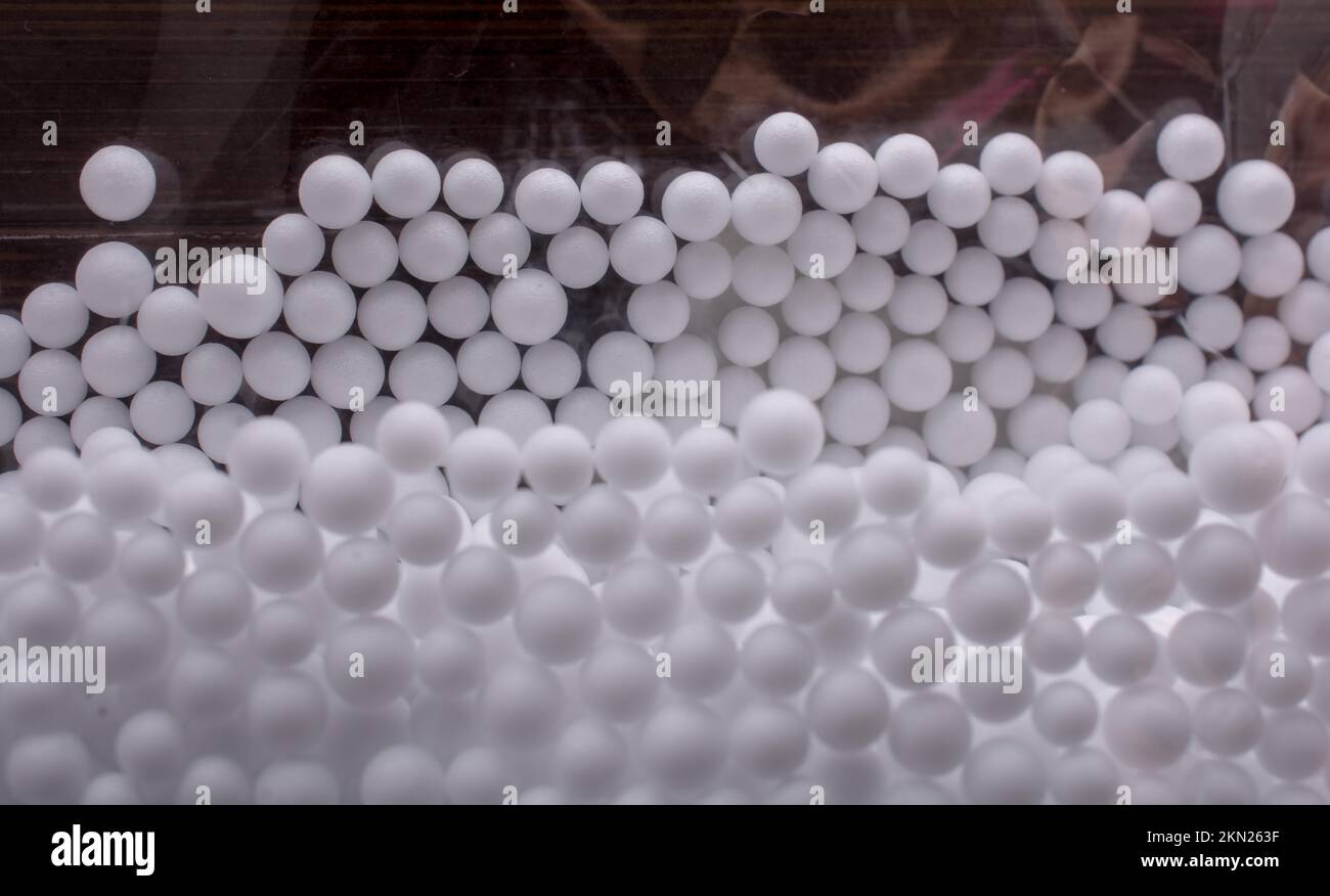 White little polystyrene foam balls as background Stock Photo - Alamy