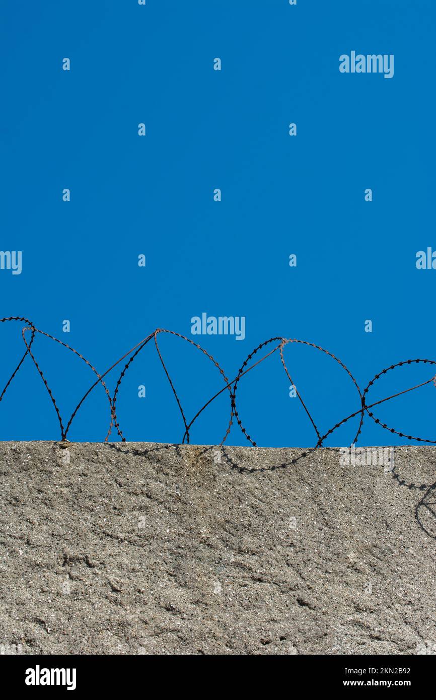 Barbed wire fence used for protection purposes Stock Photo - Alamy