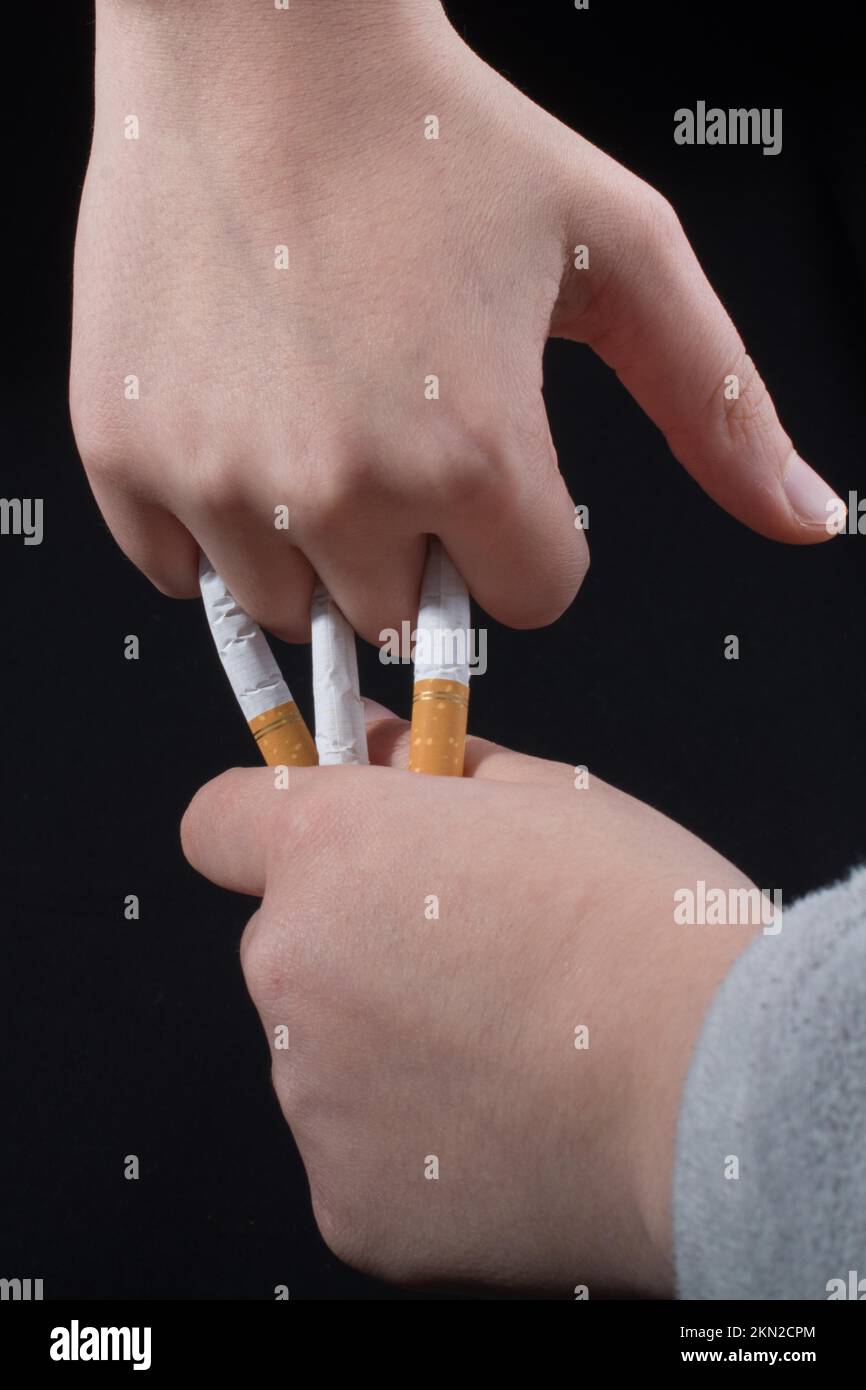 holding cigarette between middle and ring finger Holding cigarette between fingers hi-res stock photography and images