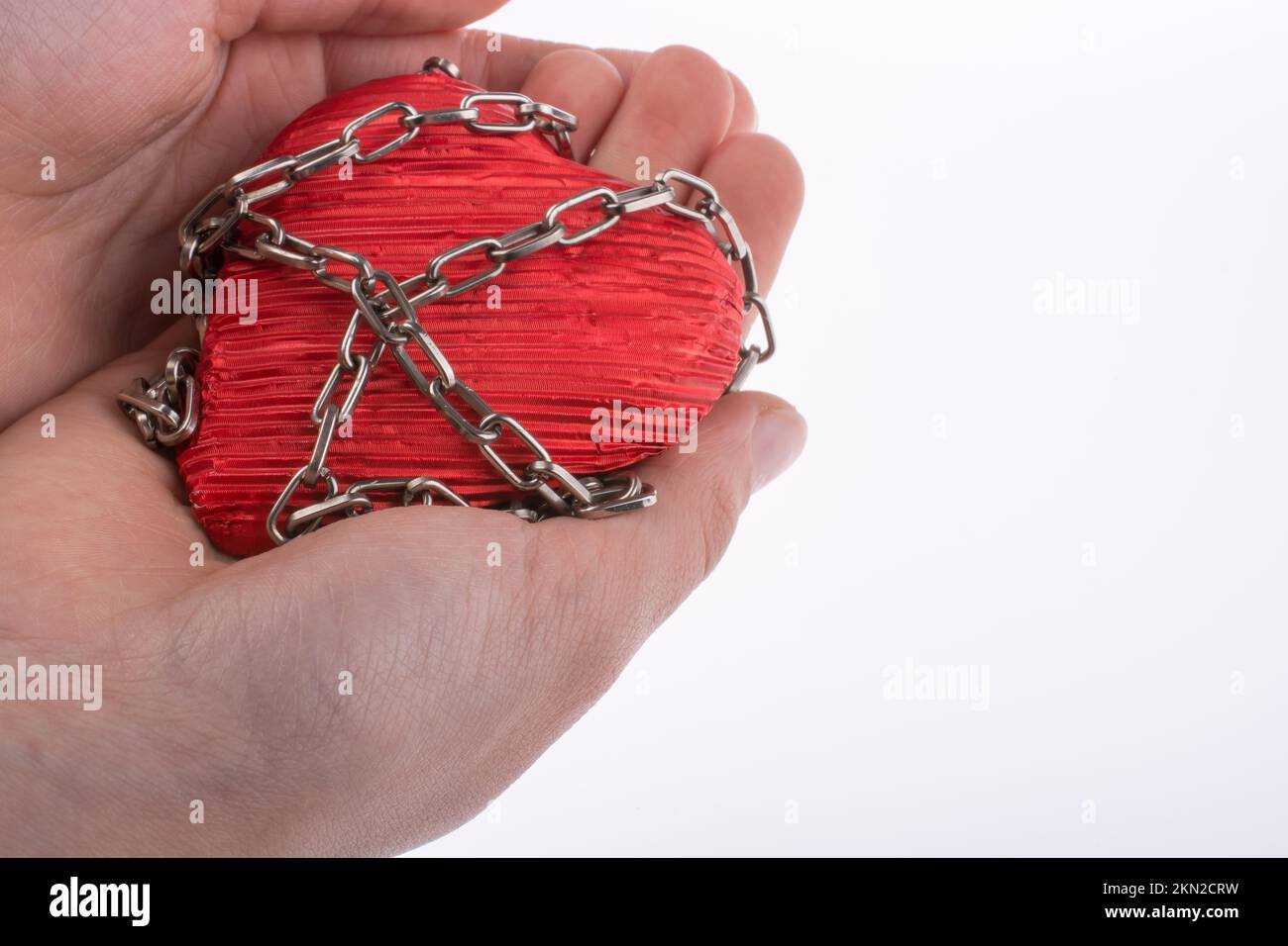 Object Chained Red color heart shaped object in Chain on white background Stock Photo ...