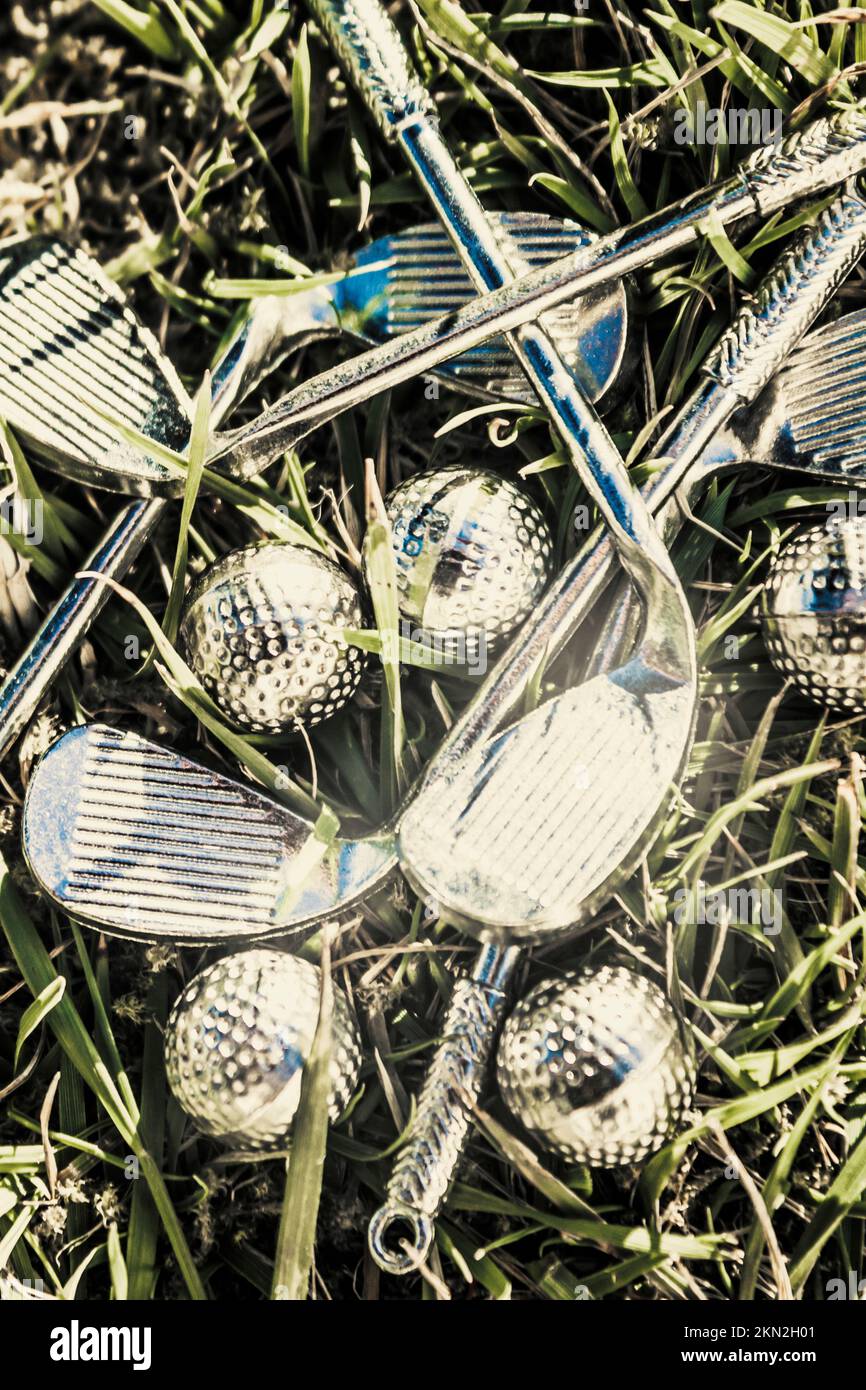 Luxury golf artwork on a precious metal set of silver golfing irons and
