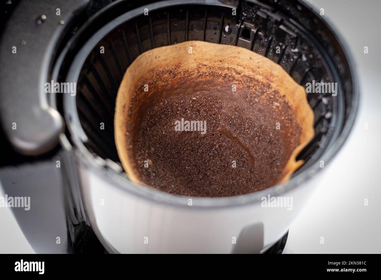 discarding used filter from coffee maker. used filter coffee in the machine. filter coffee grounds Stock Photo