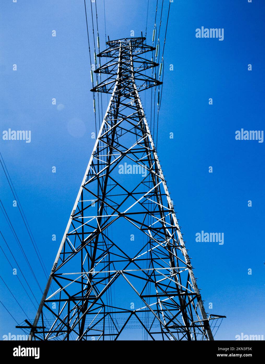 Modern blue architectural photograph on a utility pylon of power distribution. Power tower Stock Photo