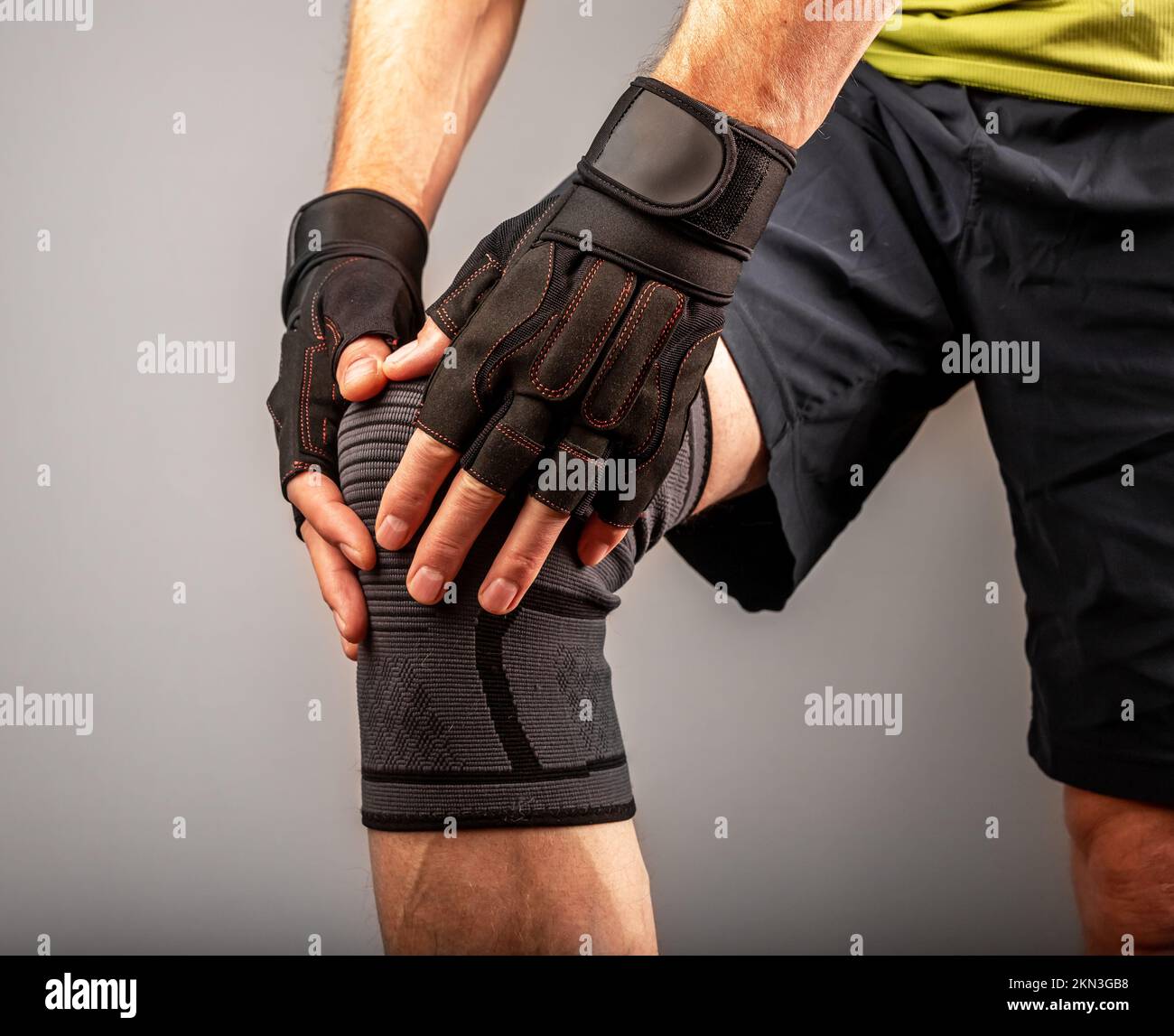 Knee pain closeup of man athlete, trauma in gym, sport workout concept