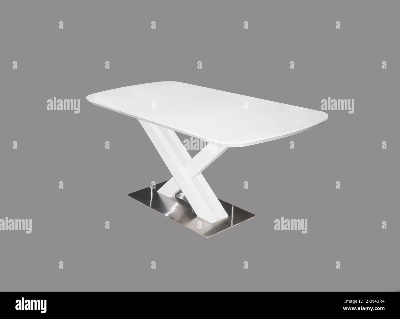 White dining table with metal leg. Interior element Stock Photo Alamy