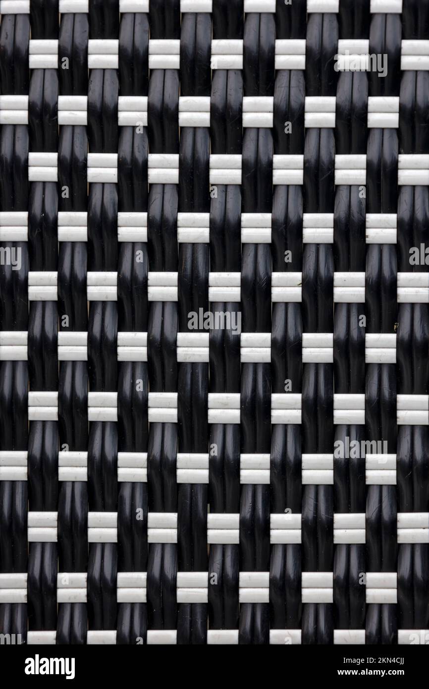 BACKGROUND TEXTURE -  Woven black and white plastic strips Stock Photo