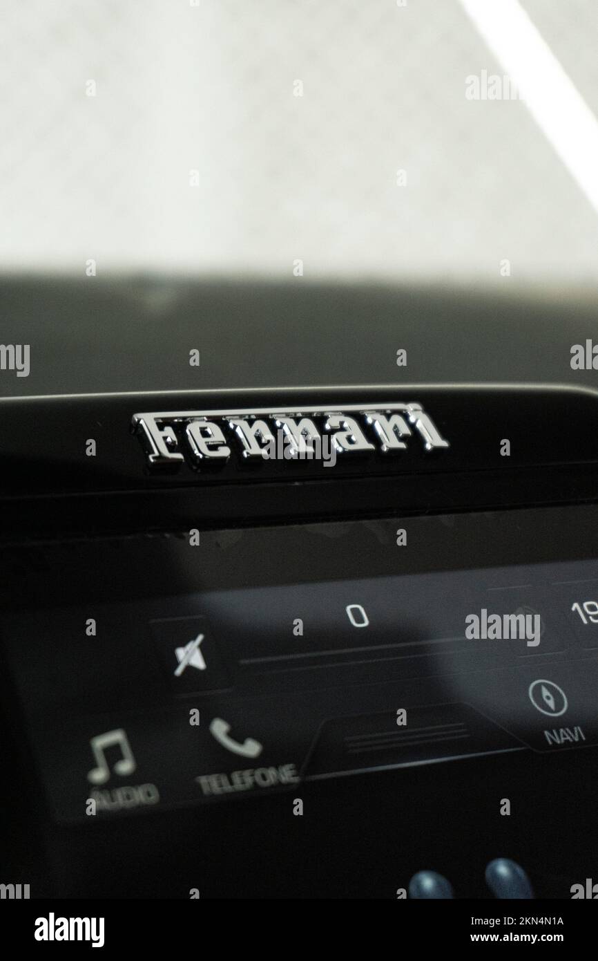 A vertical closeup of a Ferrari Roma dashboard infotainment system with ...