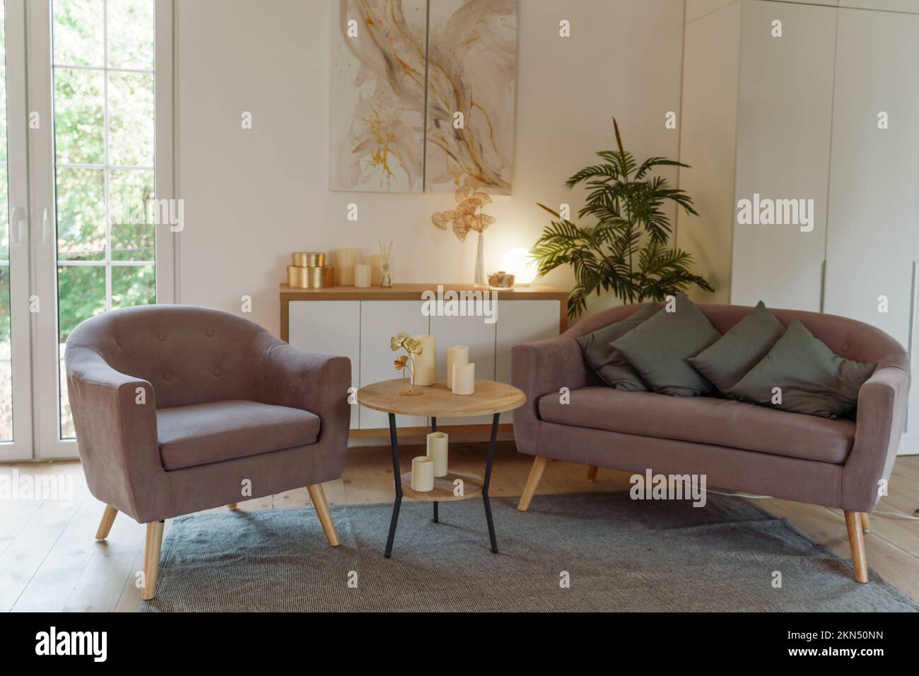 Stylish living room interior with comfortable sofa Stock Photo