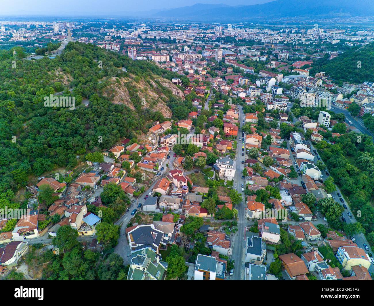 Old historical town of Plovdiv with residential buildings and churches in Bulgaria in valley of Rhodope mountains and forests Stock Photo