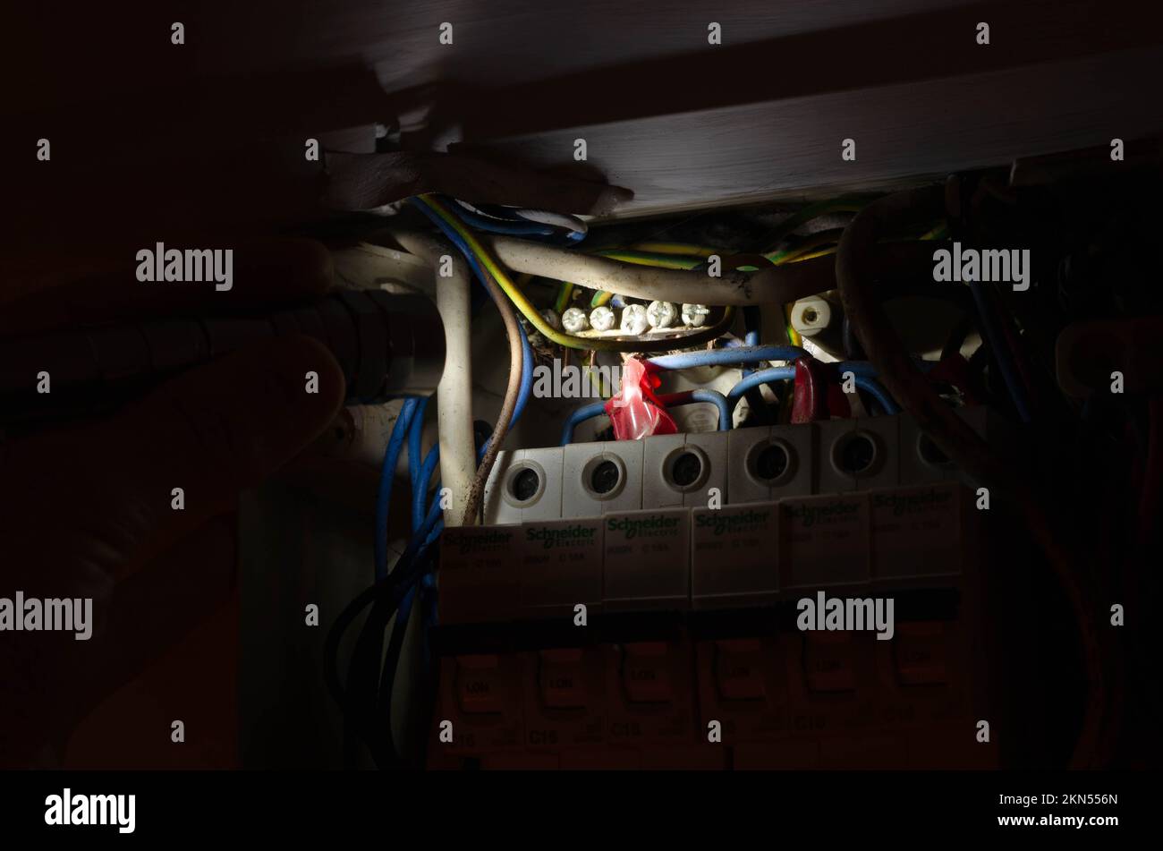 Blackout concept. Person's hand in complete darkness holding a holding