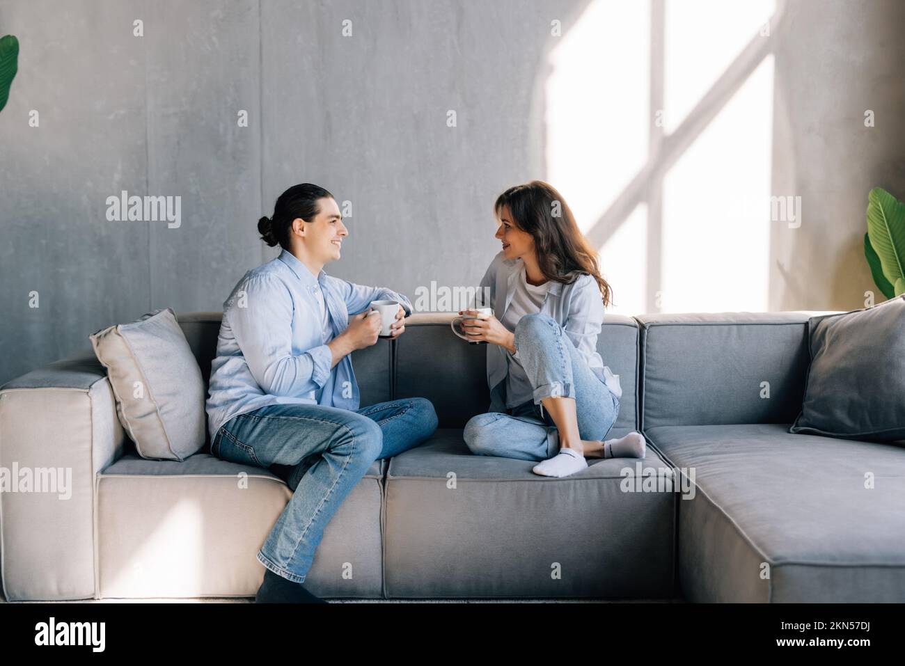 Nothing is better. Affectionate lovers spouses cuddle on couch at