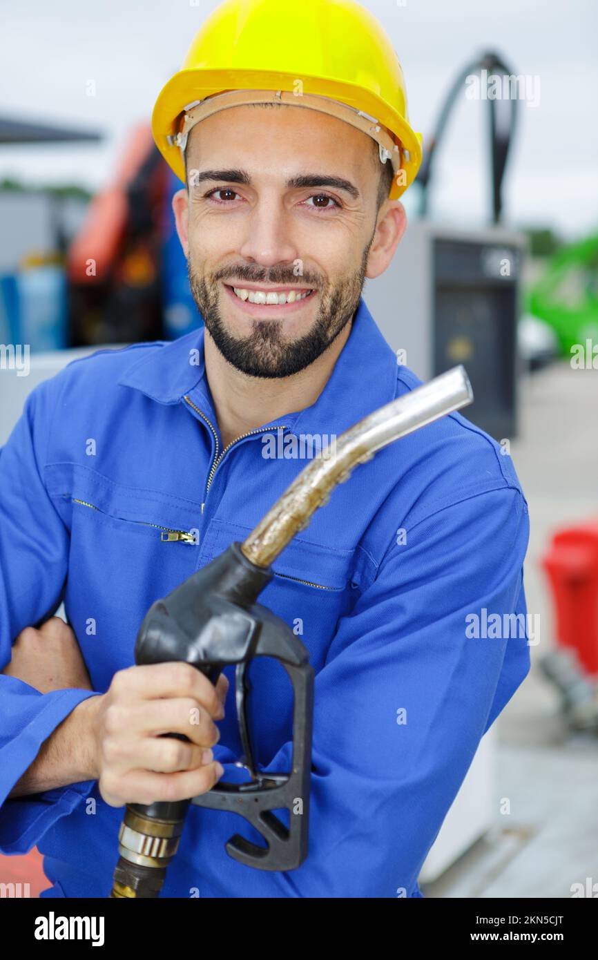 mechanic testing oil in car at the repair garage Stock Photo Alamy