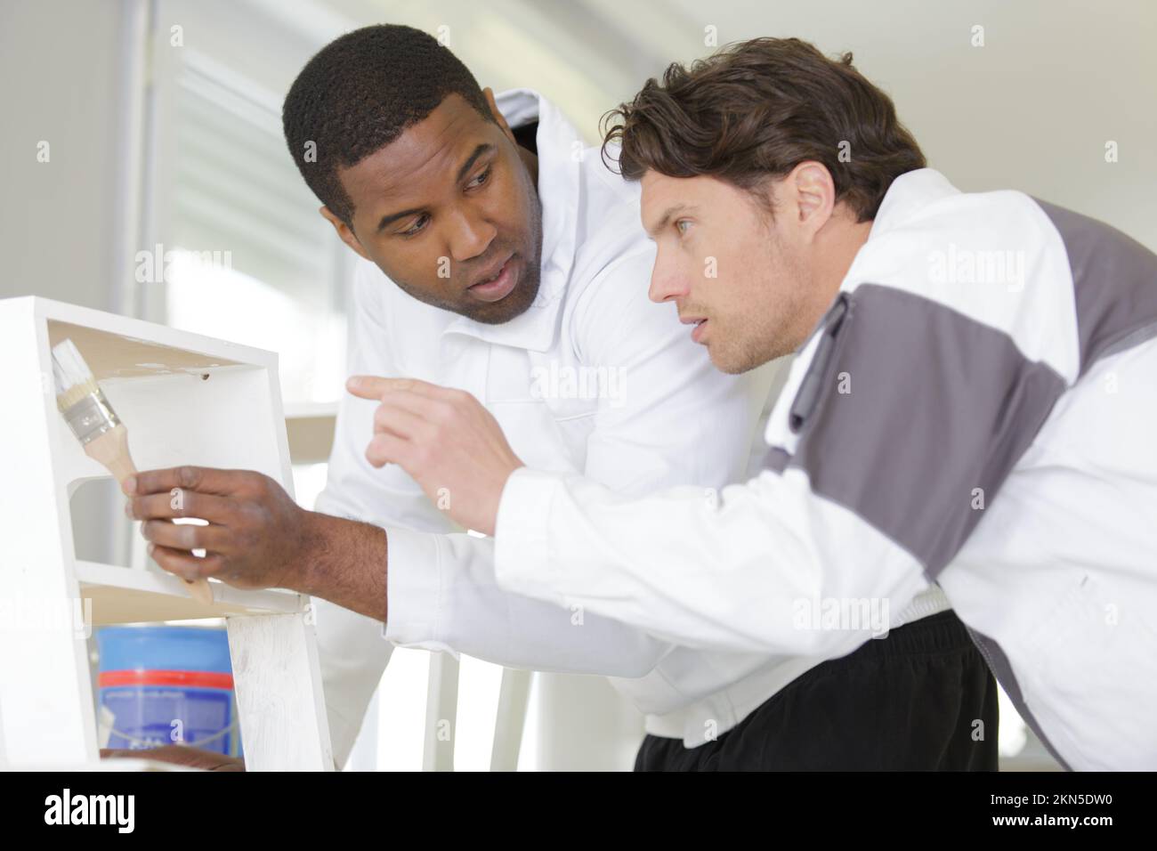 young apprentice painter in professional training Stock Photo