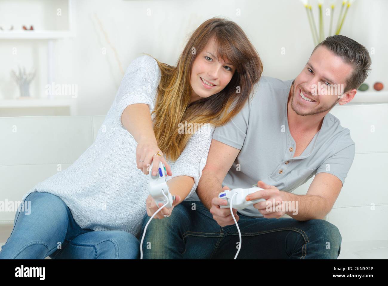 Cute couple playing video games hi-res stock photography and images - Alamy