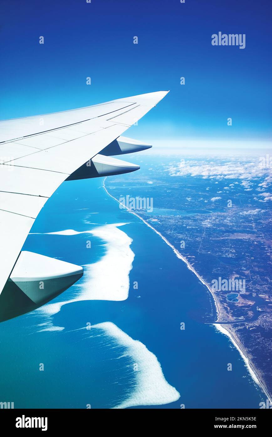 An aerial view of the aircraft wing and big waves in the ocean Stock Photo Alamy