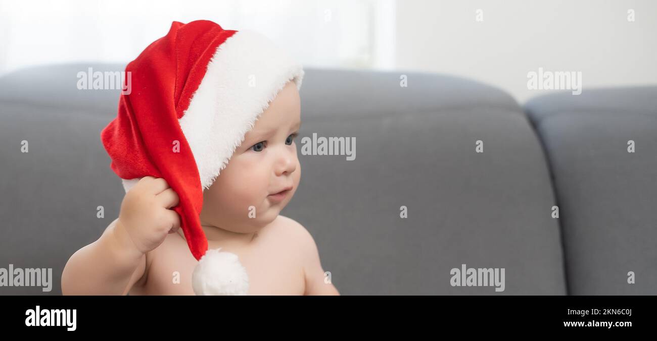 cute baby boy wearing christmas cap Stock Photo Alamy